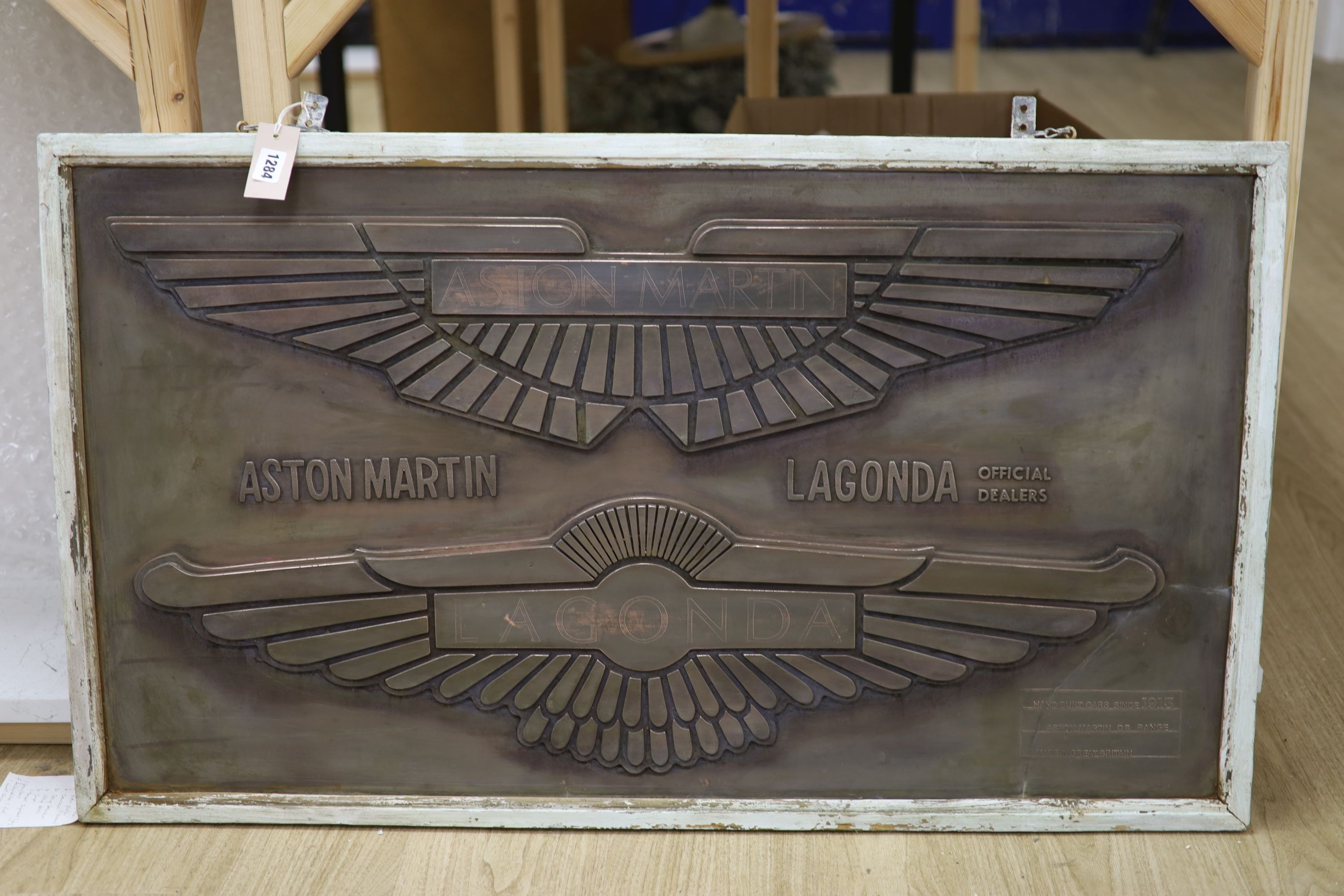 An Aston Martin / Lagonda cast copper advertising sign 55x100cm